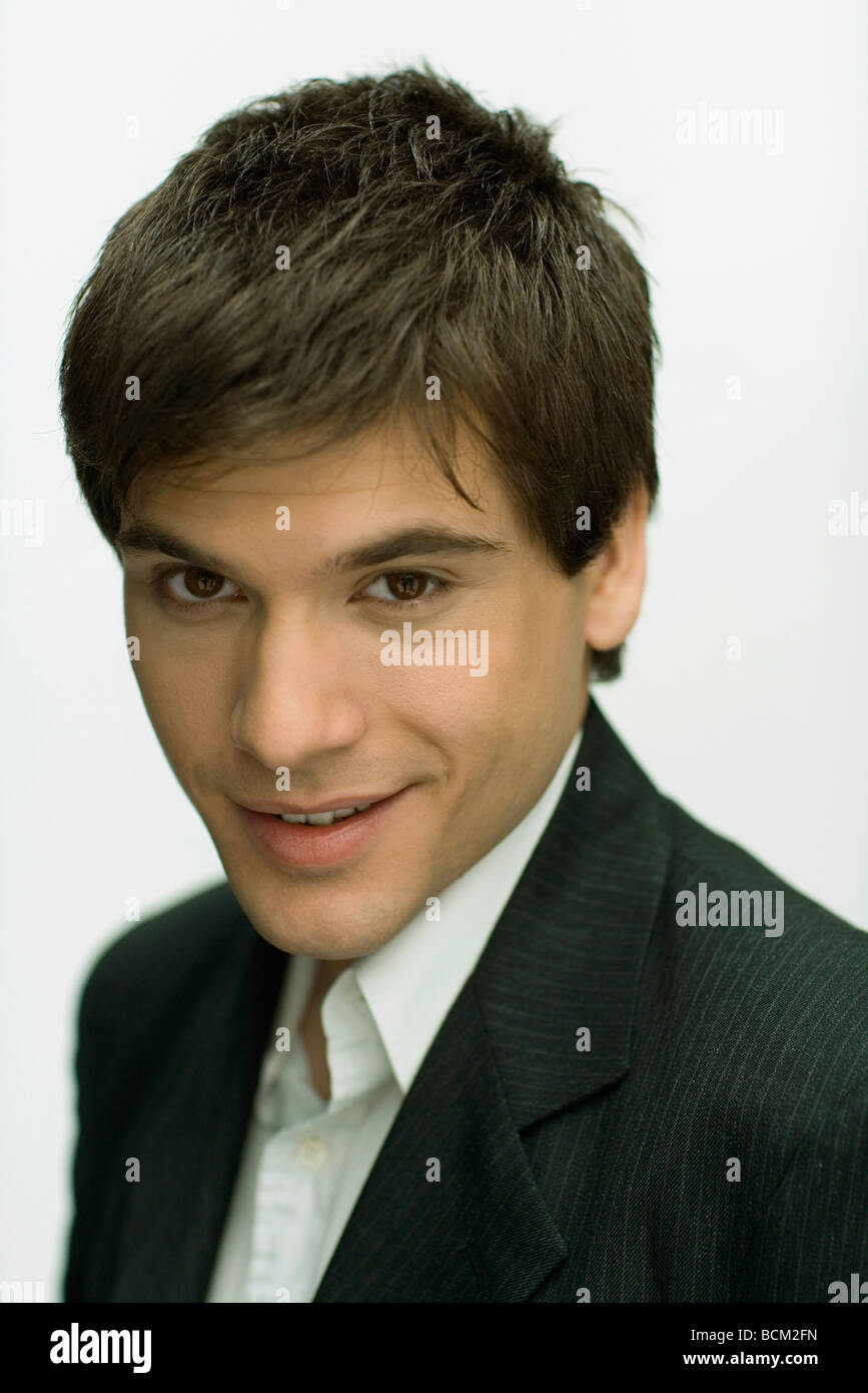 Young man smiling at camera, portrait Stock Photo - Alamy