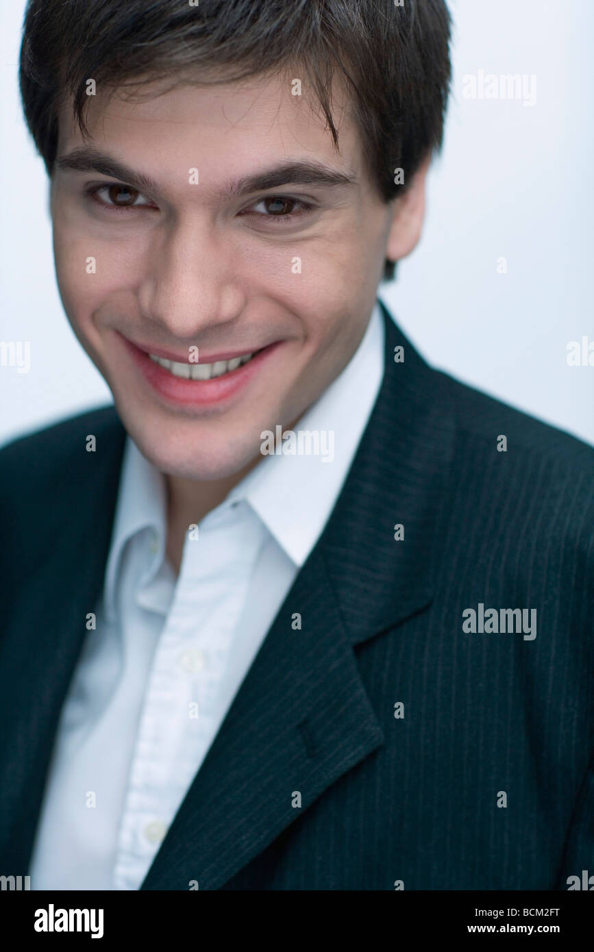Young man smiling at camera, portrait Stock Photo - Alamy