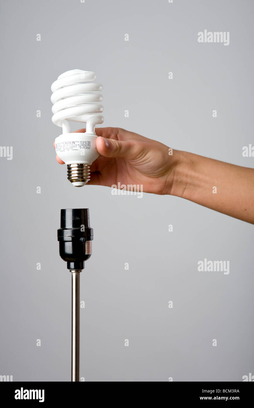 Hand changing lightbulb hires stock photography and images Alamy