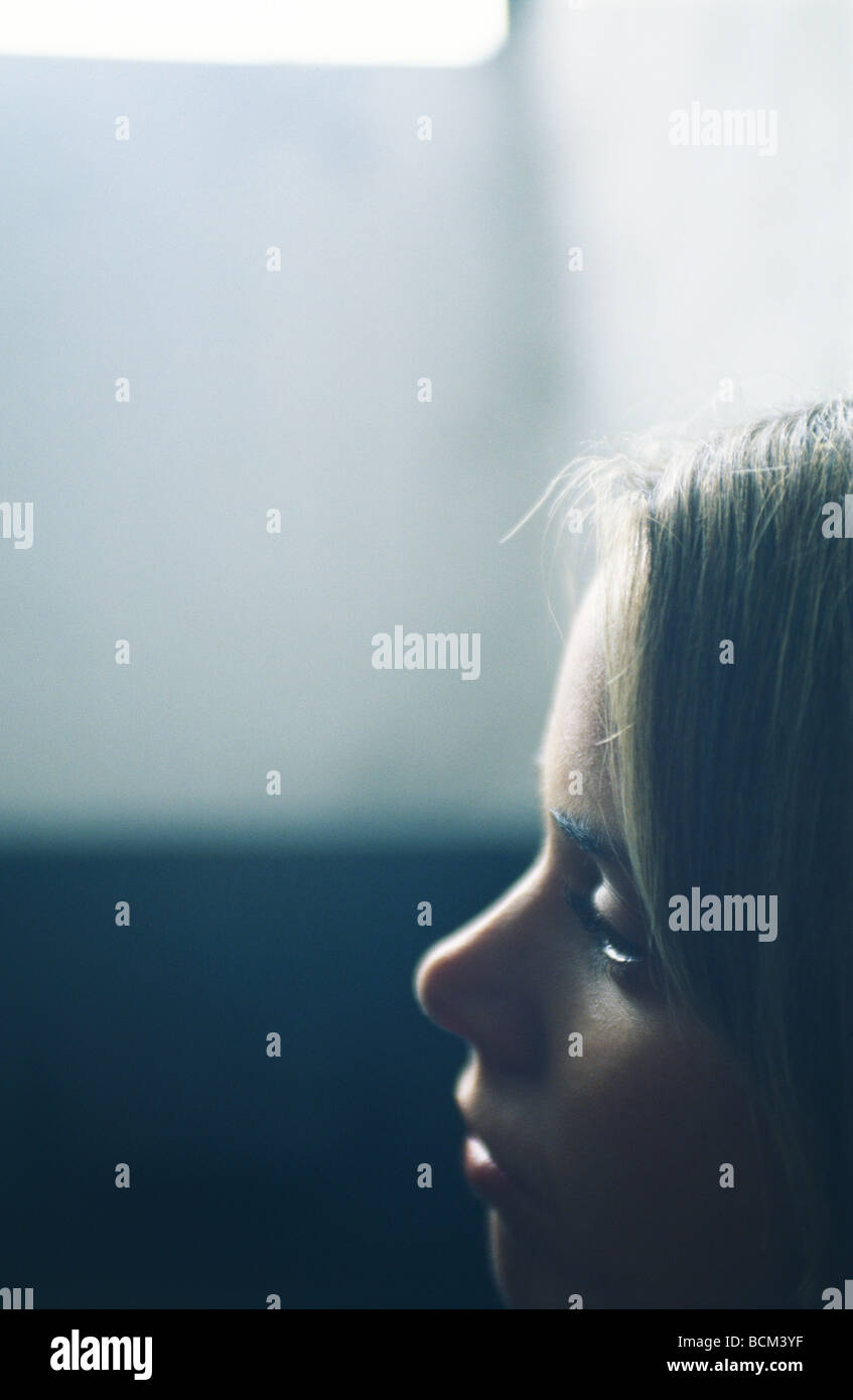 Young woman looking away, close-up, profile Stock Photo