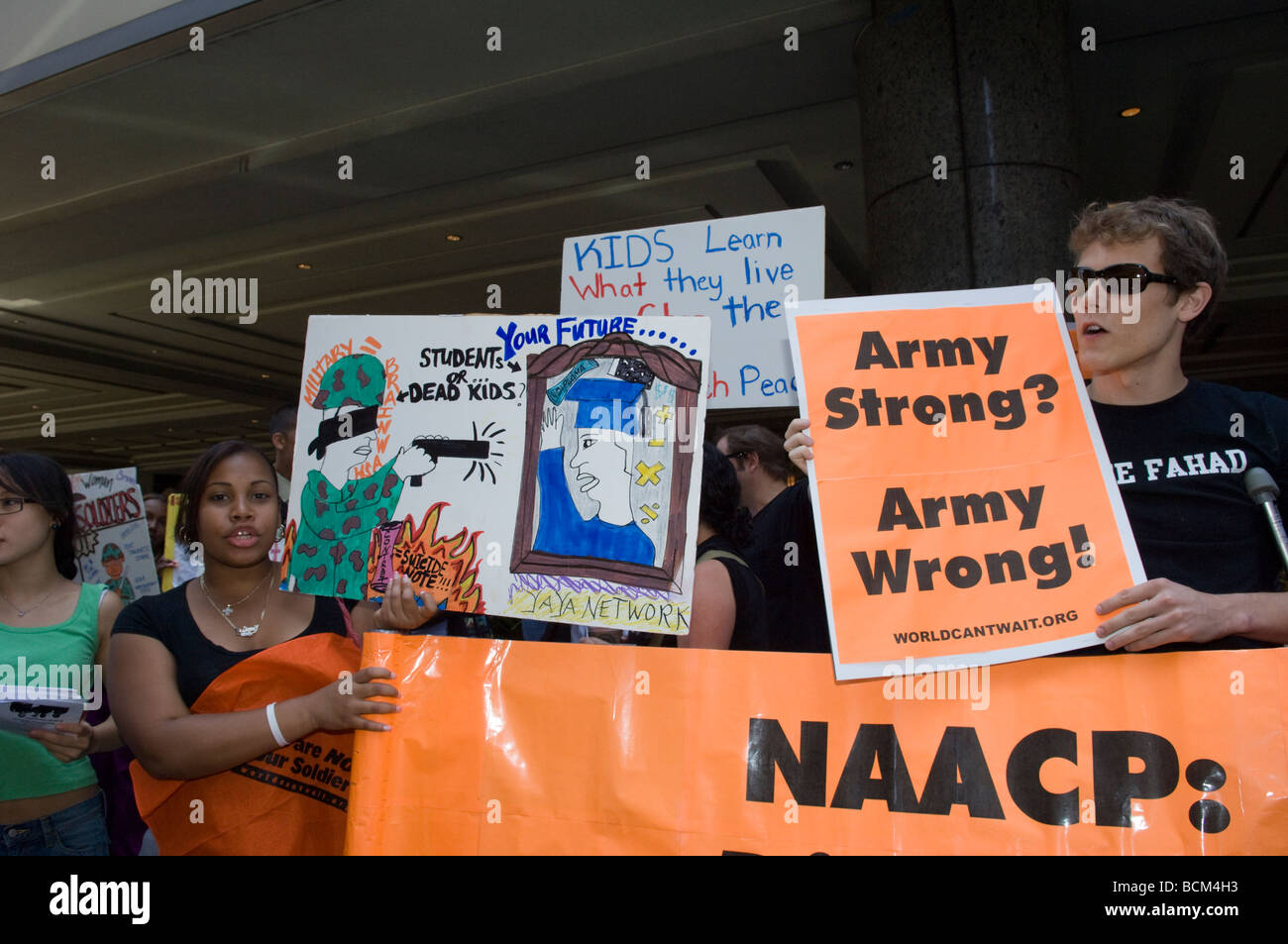 Demonstrators protest the inclusion of Army Strong recruiters outside the NAACP Diversity Job Fair in New York Stock Photo