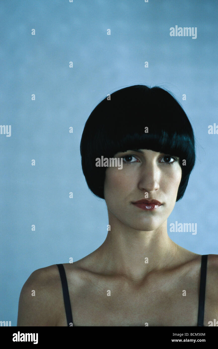 Woman with black hair looking at camera, portrait Stock Photo