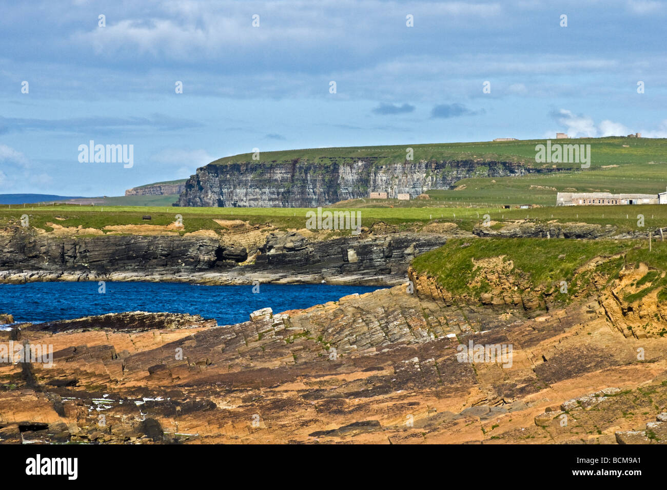Looking north along the rugged coast from near the causeway to Brough Head on the north-east corner of Mainland Orkney Stock Photo