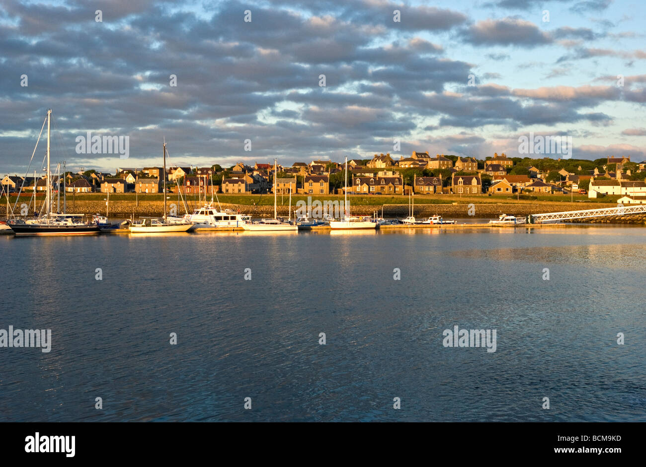 Evening light over pleasure yachts in Kirkwall harbour on the mainland of Orkney in Scotland Stock Photo