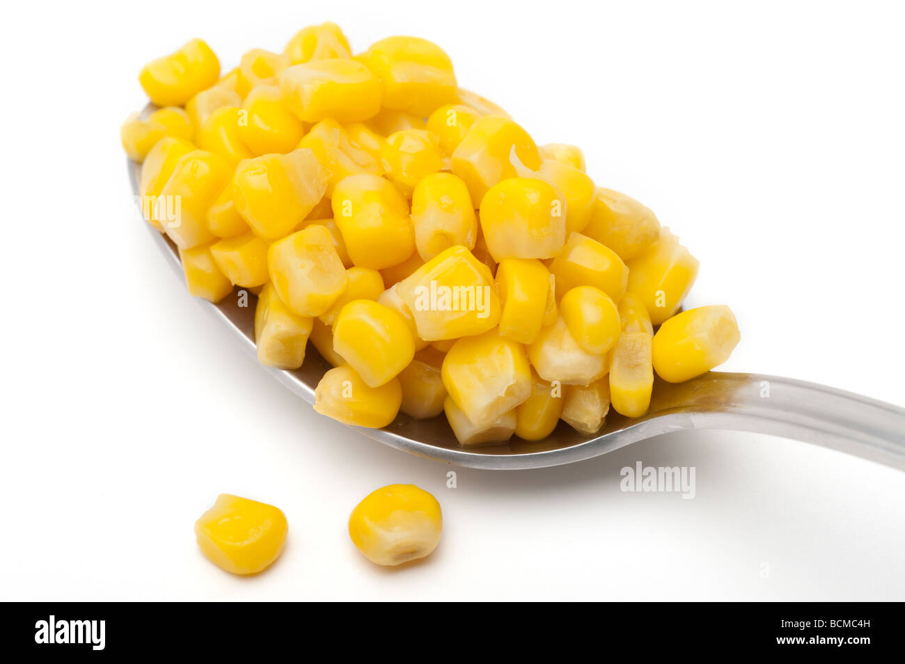 Heaped spoonful of sweetcorn Stock Photo