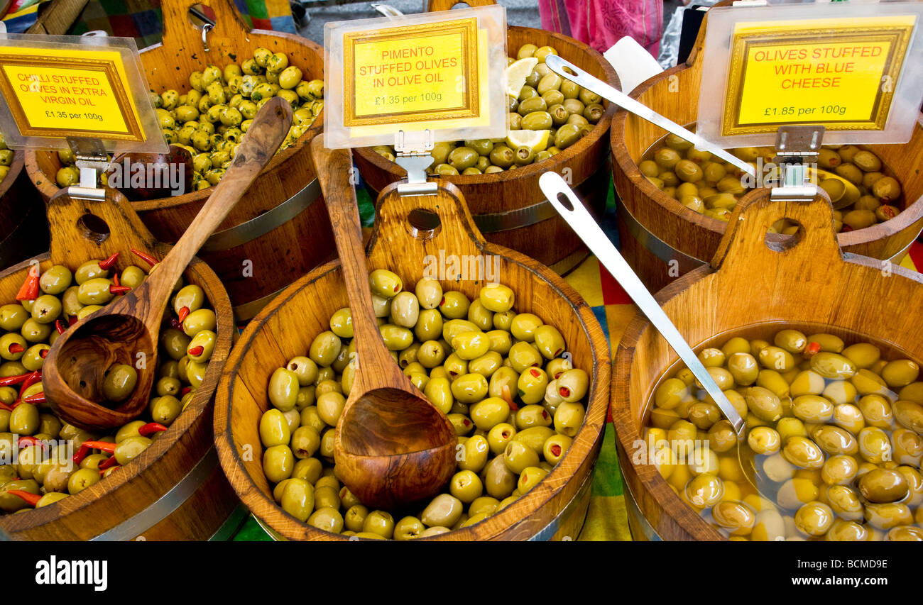An olive stall at the Thursday farmer s market in the typical English market town of Devizes Wiltshire England UK Stock Photo