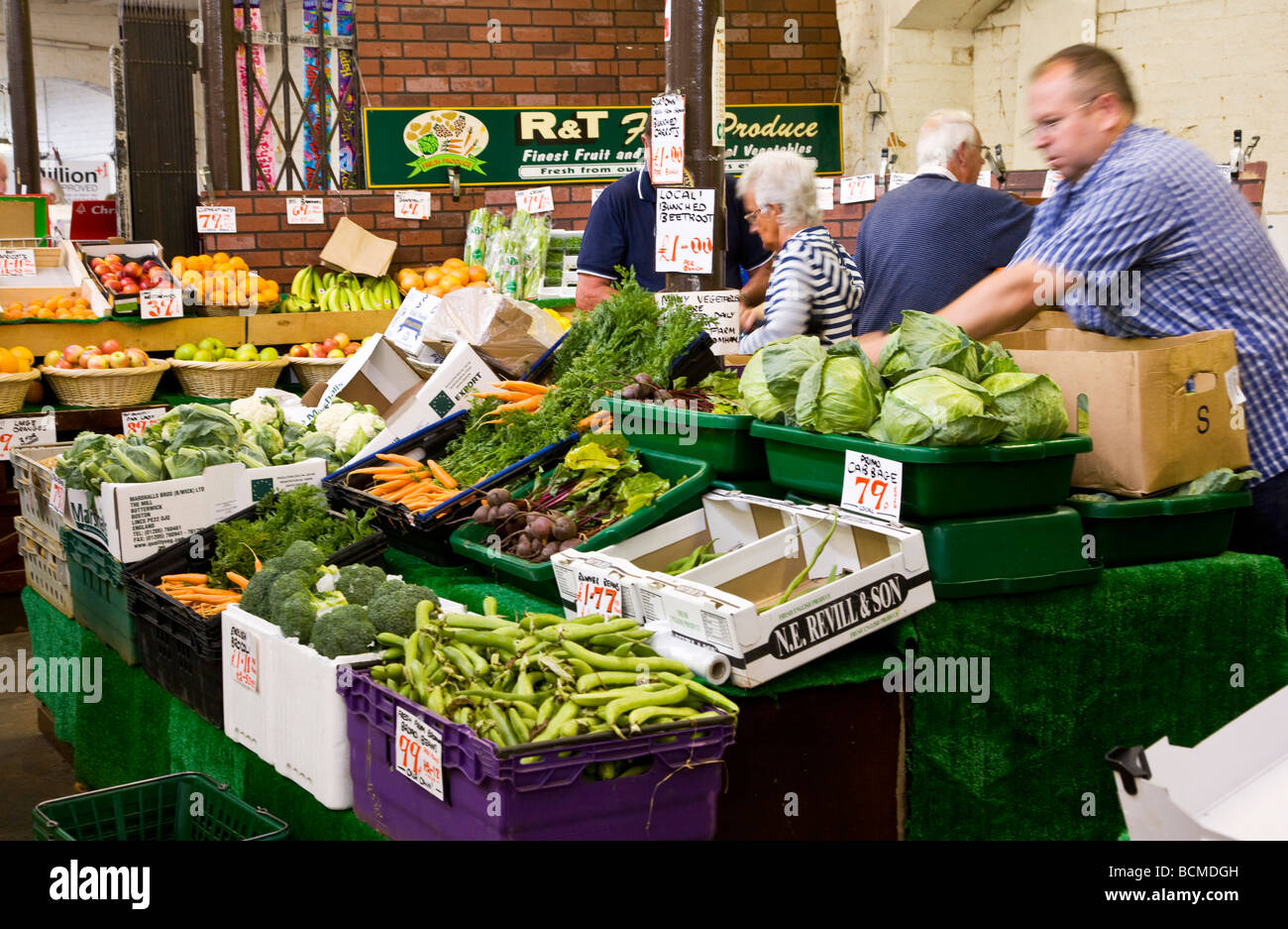 An greengrocers stall at the Shambles Indoor market in the typical English market town of Devizes Wiltshire England UK Stock Photo