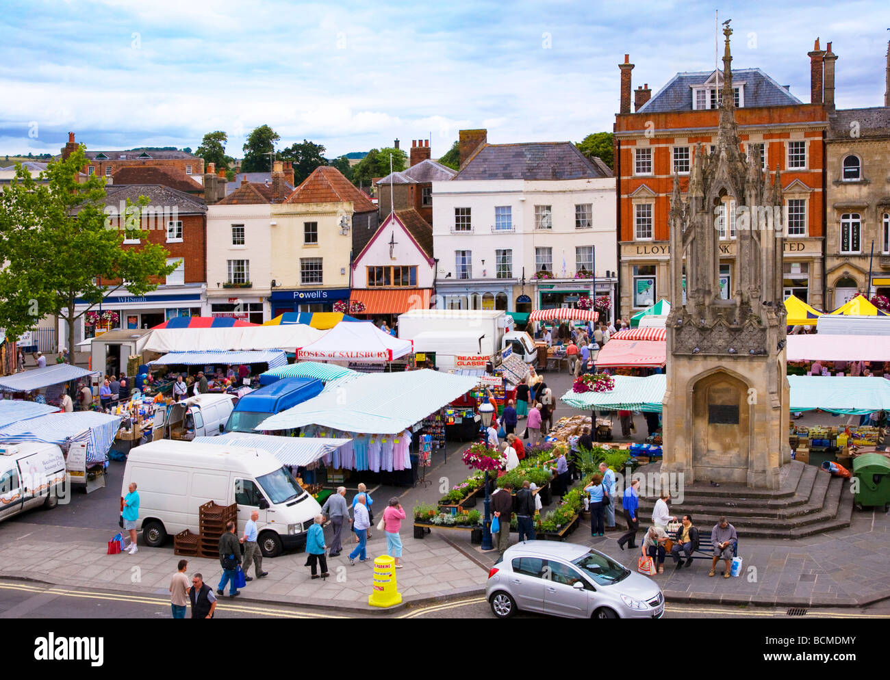 Elevated view of the Thursday farmer's market and medieval market cross in the English town of Devizes Wiltshire England UK Stock Photo