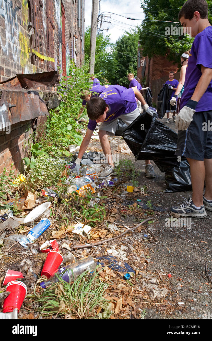 High School Volunteers Clean Trash from Alley Stock Photo Alamy