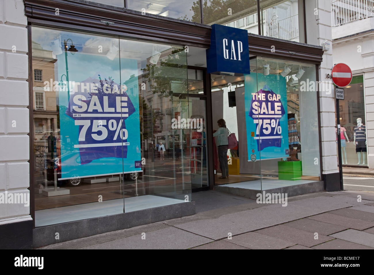 GAP sale notices in shop window offering big discount Cheltenham UK Stock  Photo - Alamy