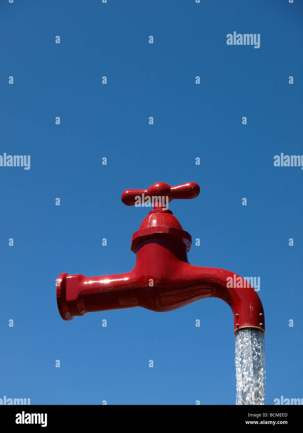 Giant red tap fountain, Cala Galdana, Menorca, Spain Stock Photo