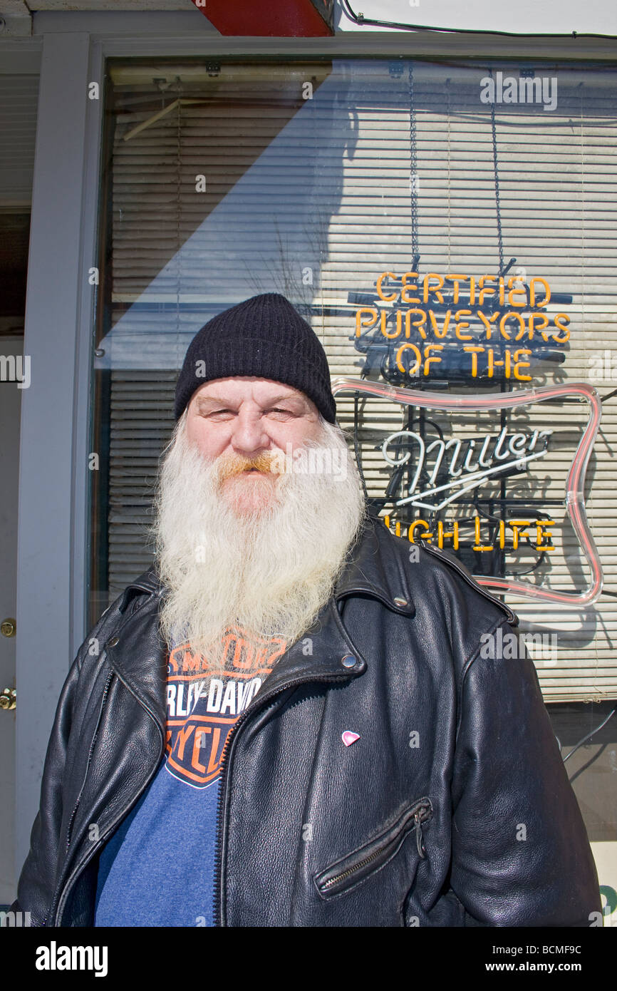 Local man in leather jacket stands outside saloon on Ogden's historic 25th Street. Stock Photo