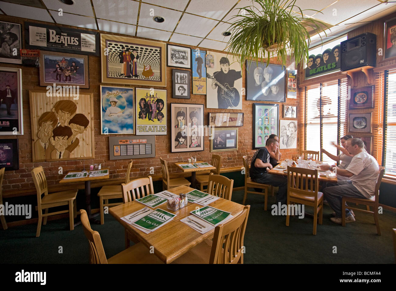 Diners inside City Club a cozy brew pub on Ogden' s Historic 25th Street, known for its big collection of Beatles memorabilia Stock Photo