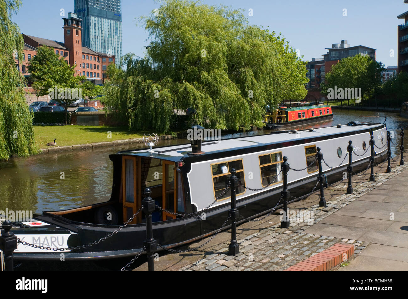 Canal barge on the Bridgewater Canal with the Beetham Tower Castlefield ...