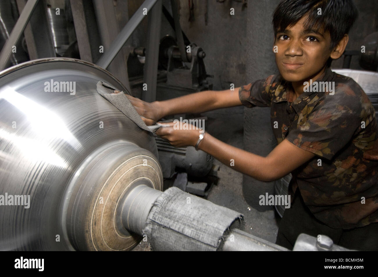 Dhaka child labour Metal turning factory Stock Photo - Alamy