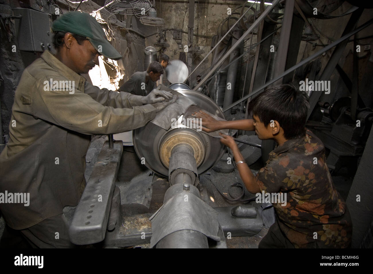 Dhaka child labour Metal turning factory Stock Photo - Alamy