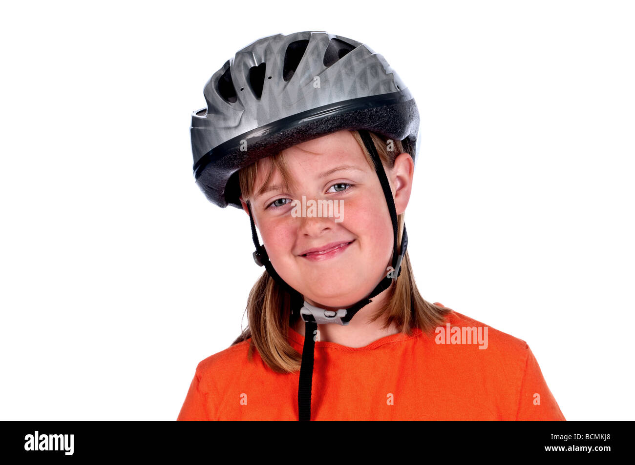 A horiizontal image of a smiling young girl wearing a helmet Stock Photo