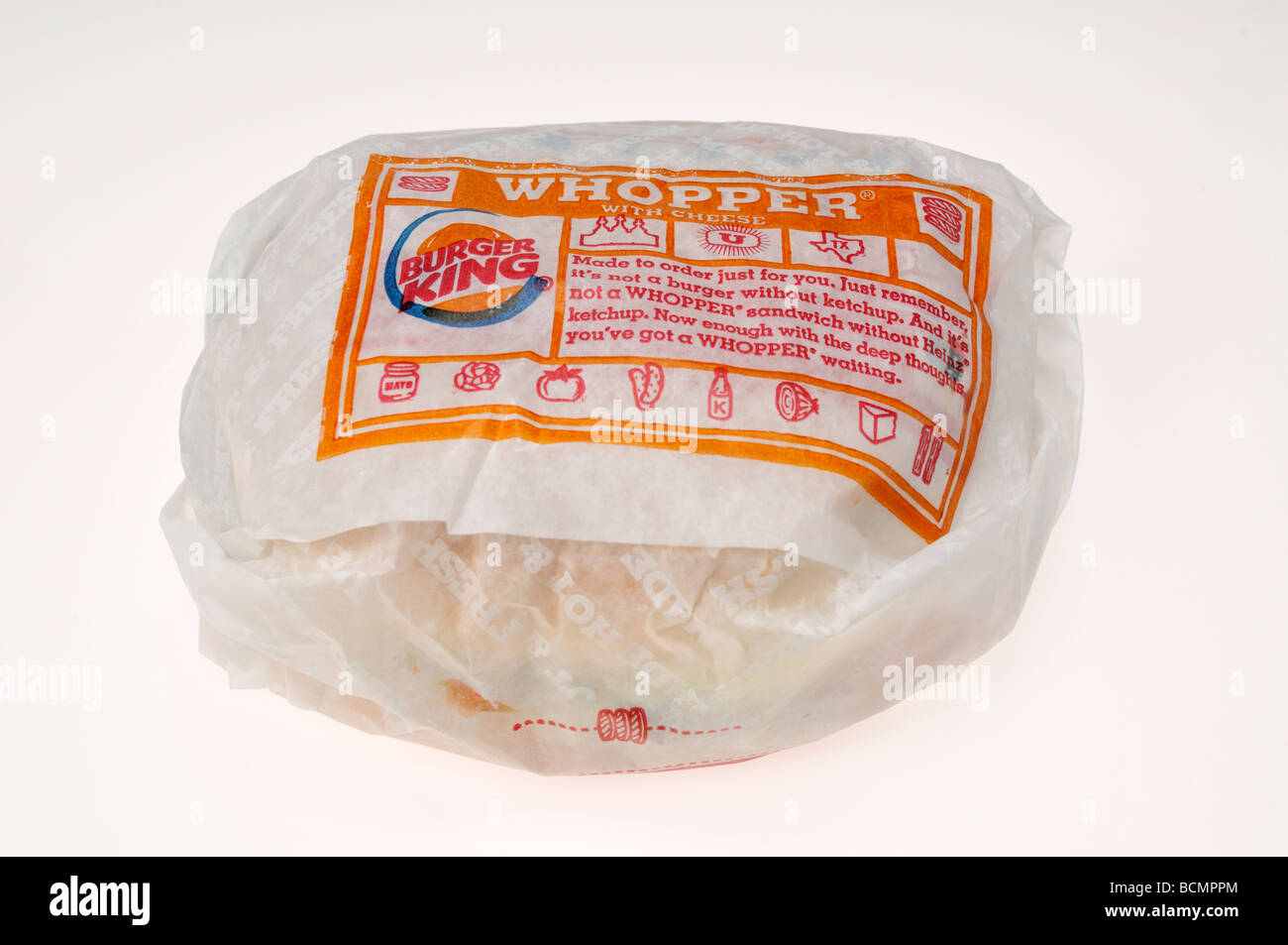 Burger King Whopper in wrapper on white background. Cut out Stock Photo Alamy