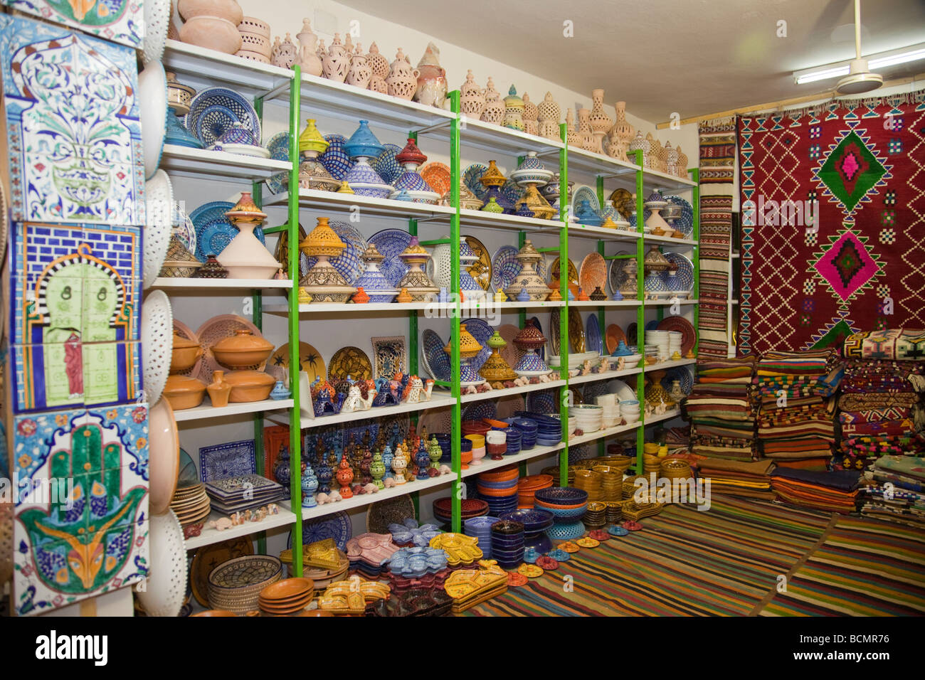 A shop in Tozeur, Tunisia sells rugs, clothing, and other traditional