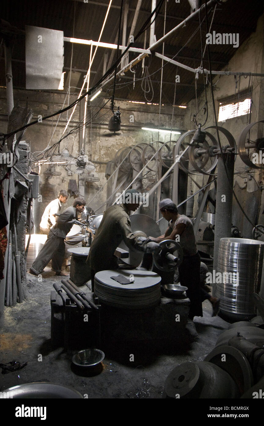 Dhaka child labour Metal turning factory Stock Photo - Alamy