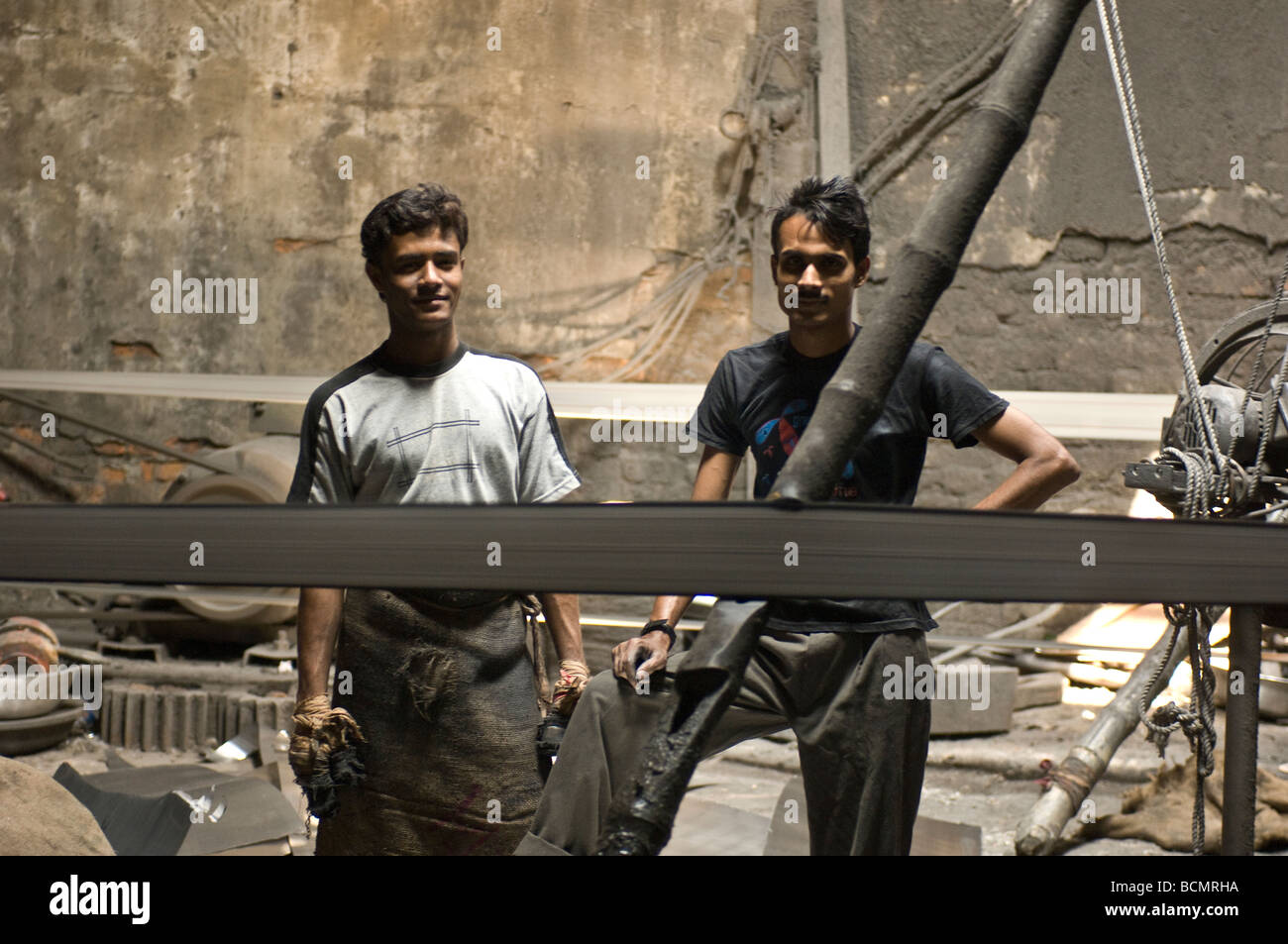 Young men in Dhaka metal works factory Bangladesh Stock Photo