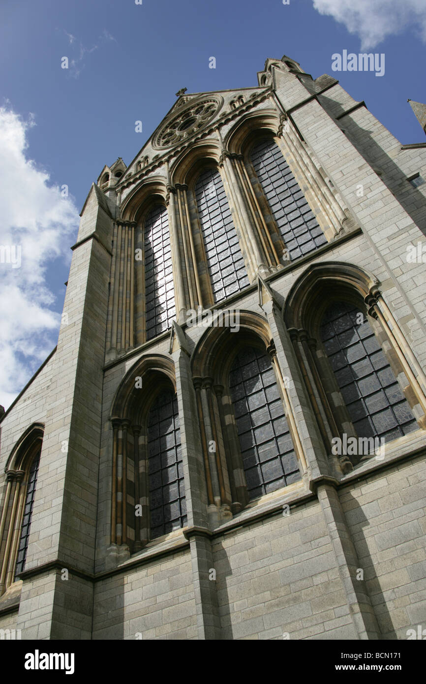 City of Truro, England. Low angled view of the stained glass windows and rose window on the east elevation of Truro Cathedral. Stock Photo