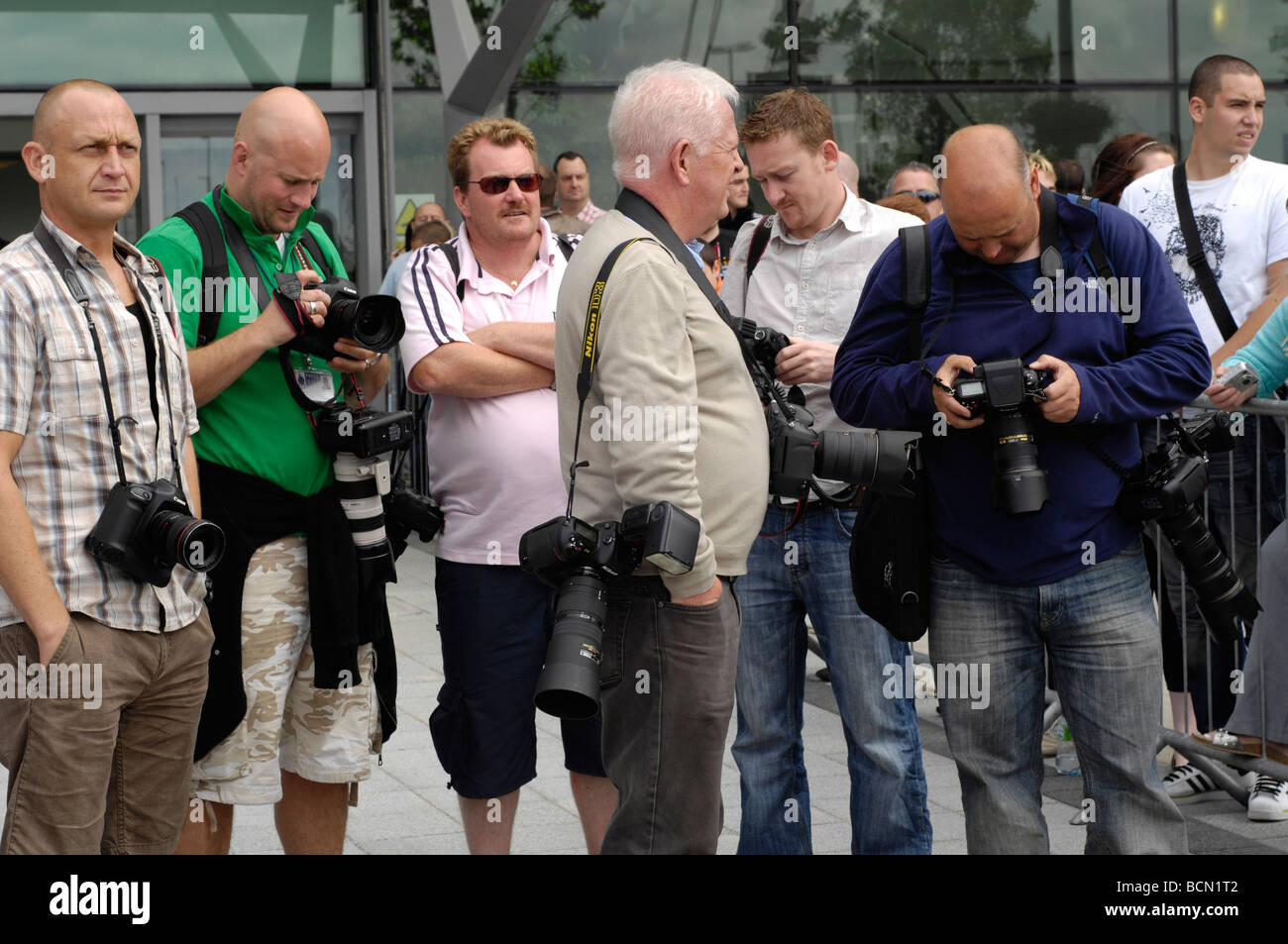 press photographers waiting for carlos tevez to arrive at city of manchester stadium Stock Photo
