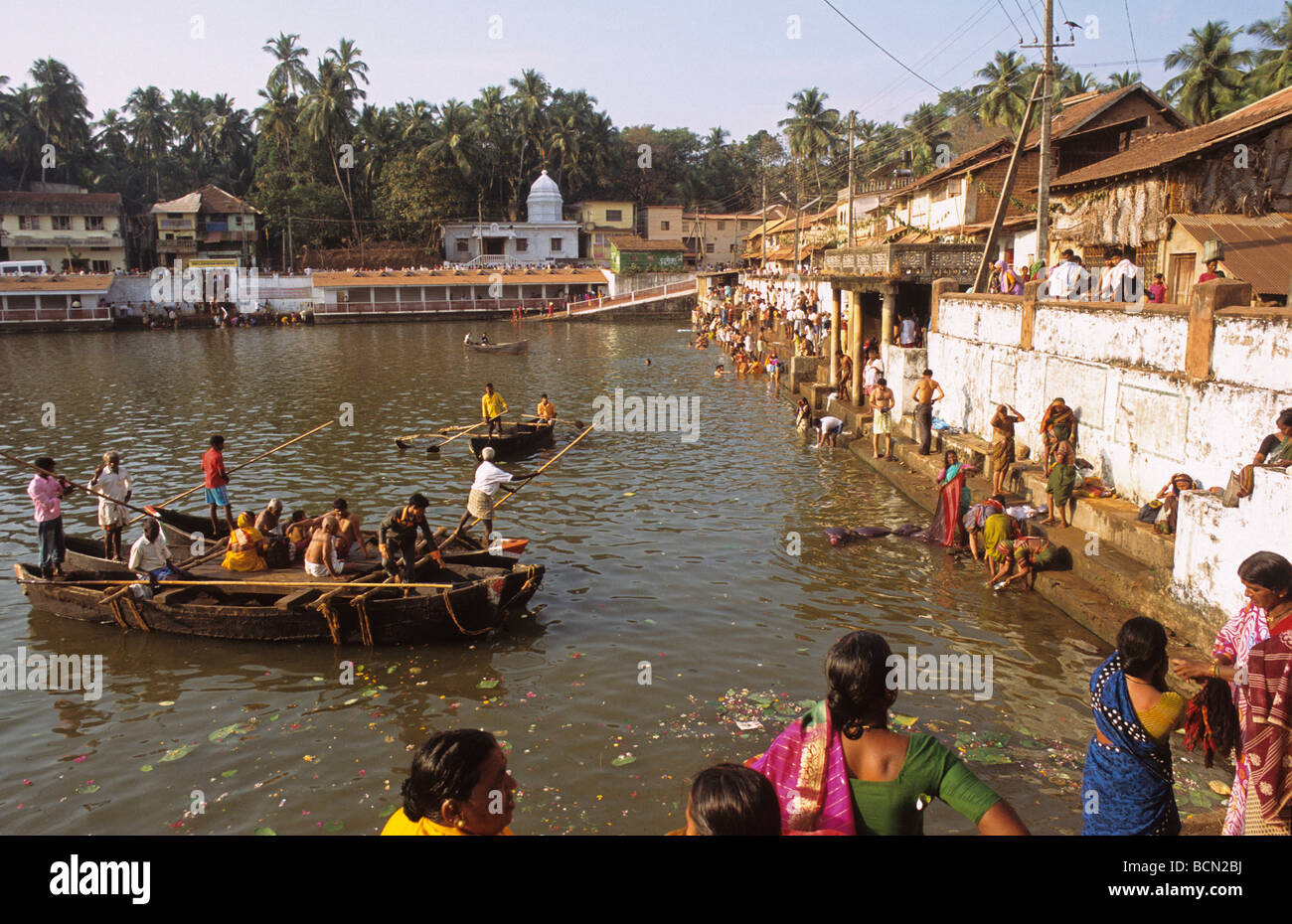 Pilgrims Bathe in the Kooti Teertha Temple Reservoir during Shivaratri Festival Gokarna Karnataka India Stock Photo
