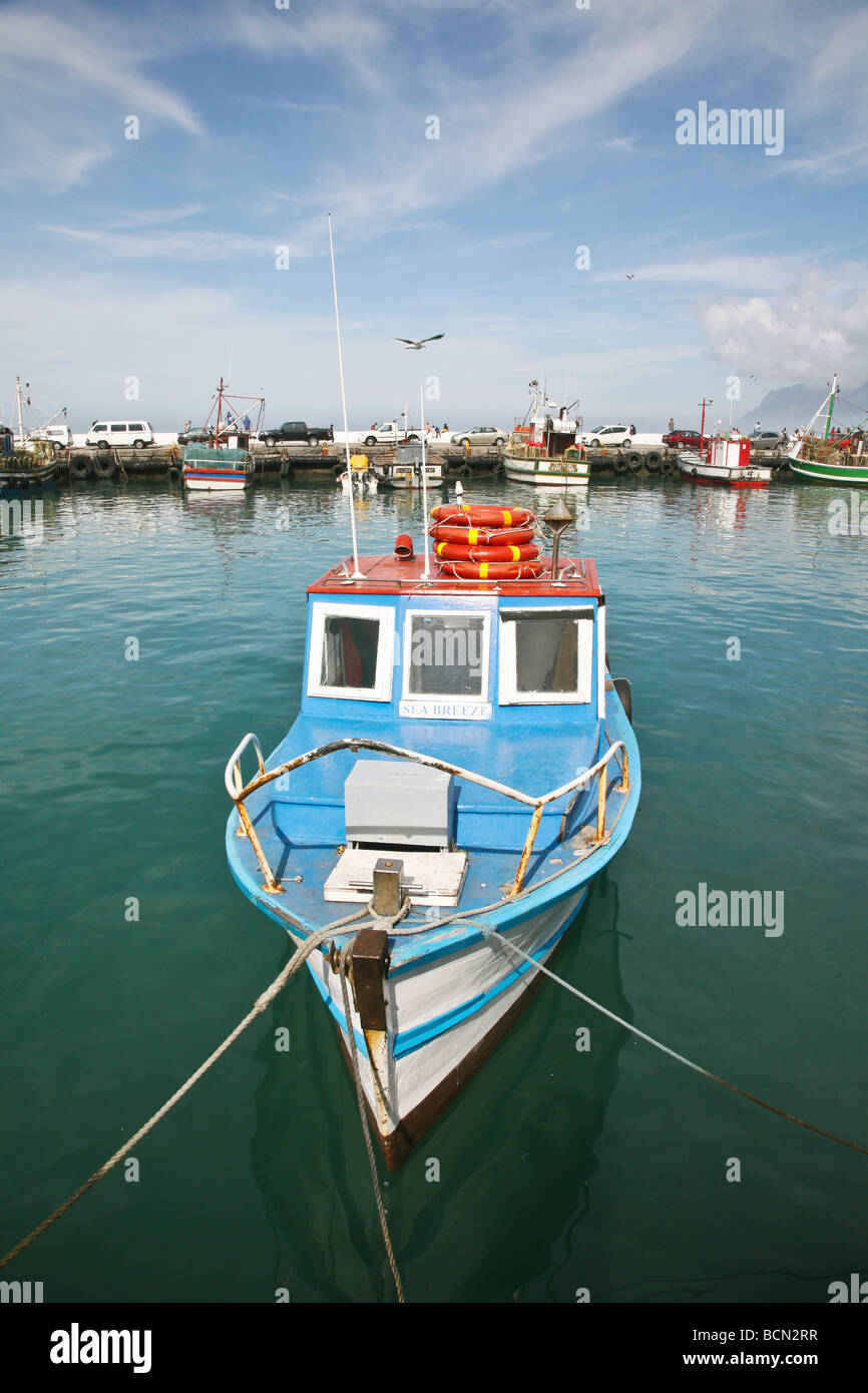 Small blue fishing boat moored at Kalk Bay Harbour, Kalk Bay Stock Photo