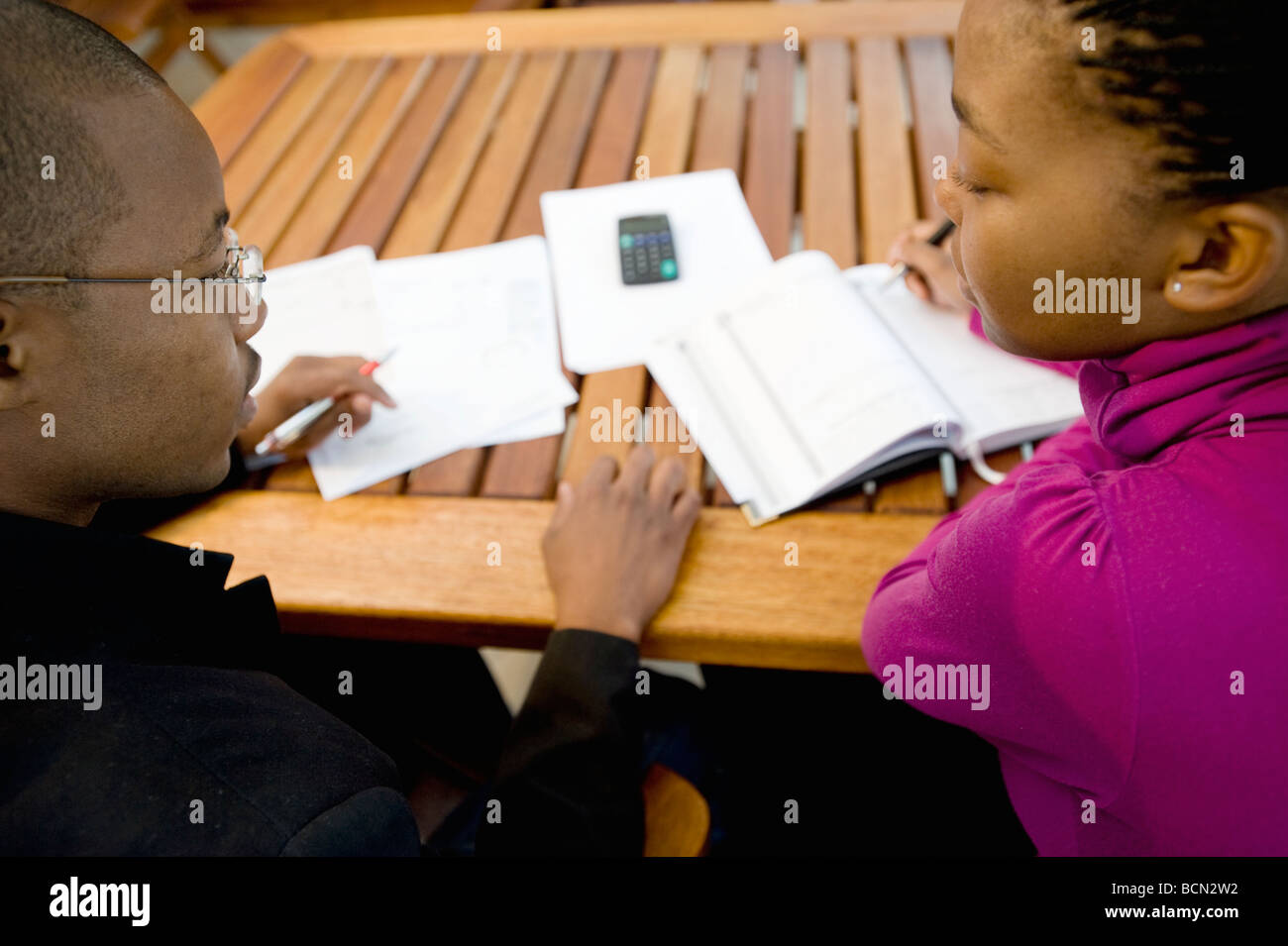 A young couple discussing finances Stock Photo