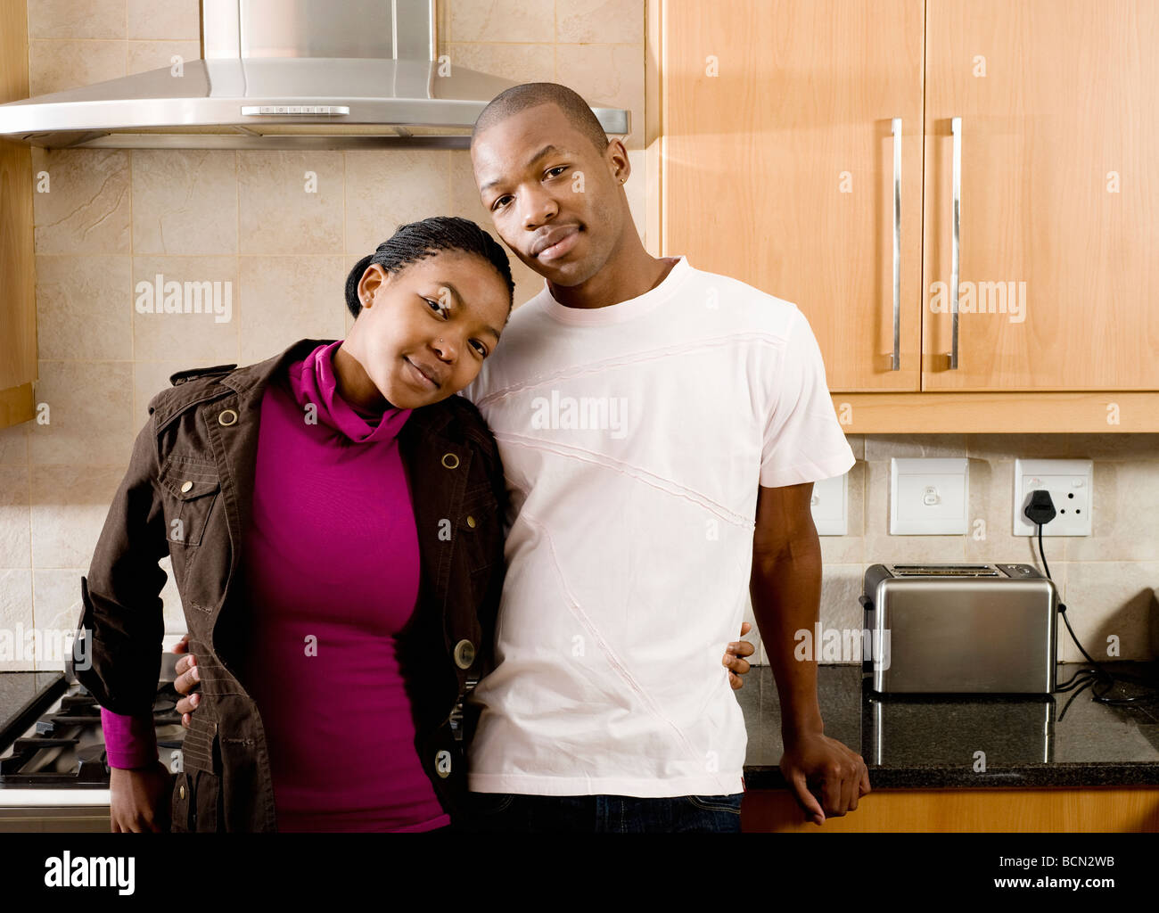 Portrait young smiling couple kitchen hi-res stock photography and ...