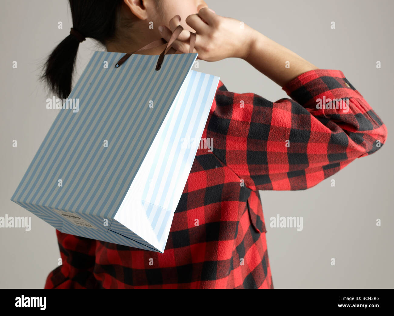 Woman Carrying Shopping Bag on Shoulder Stock Photo