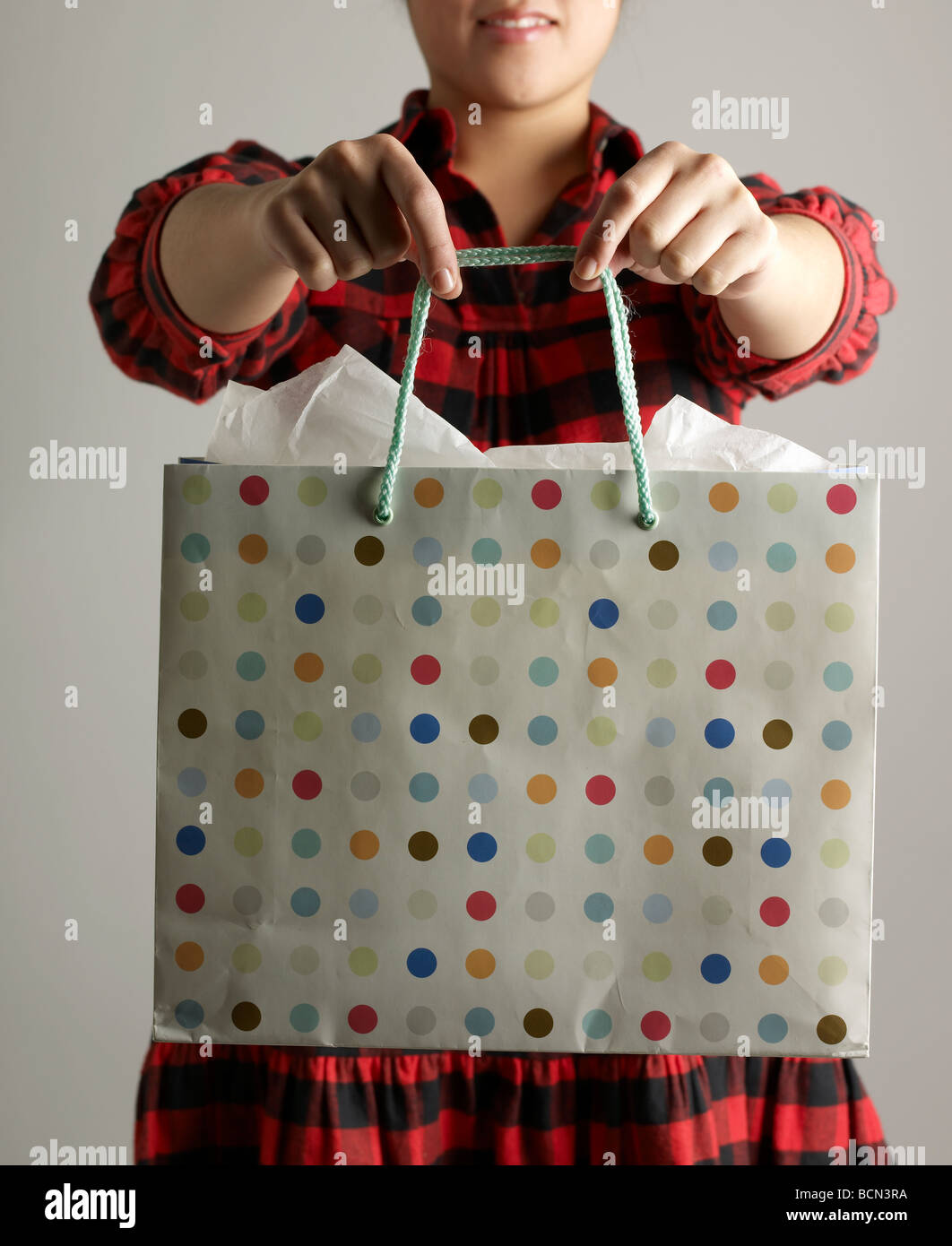 Mid-Adult Woman Holding Shopping Bag Stock Photo