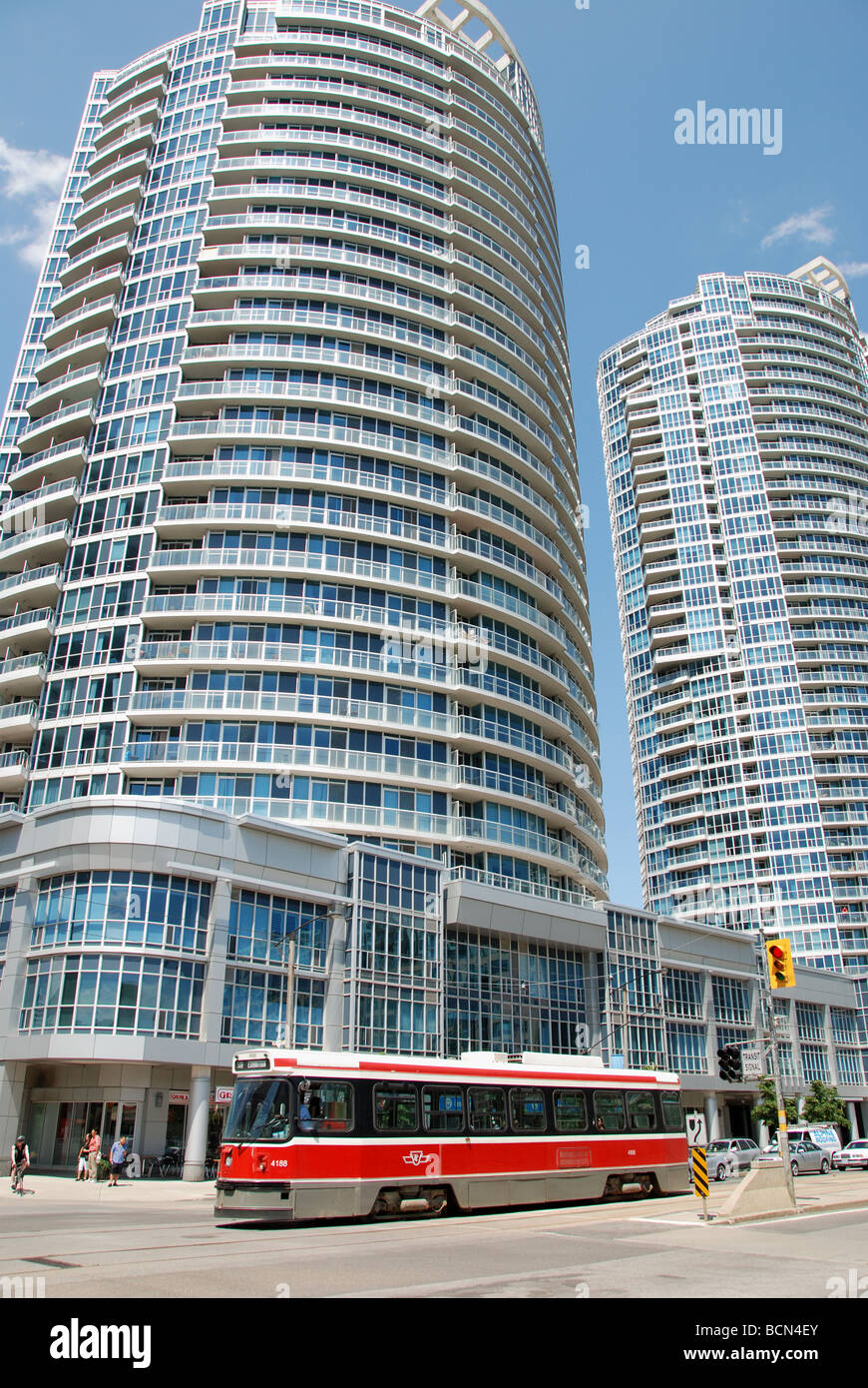 A streetcar in Toronto passing one of the many condominiums built in