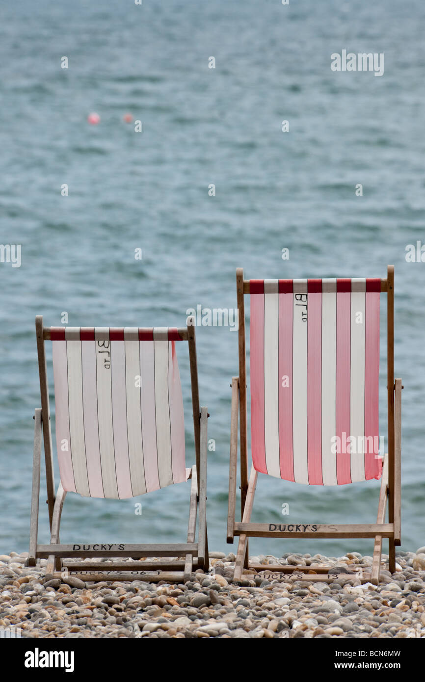 Deckchairs on the beach at Beer in Devon Stock Photo