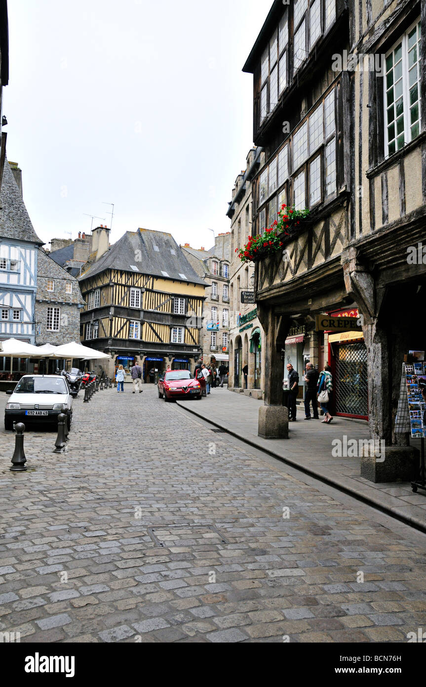 Street view of Dinan France showing stone and half timbered buildings and cobbled streets Stock Photo