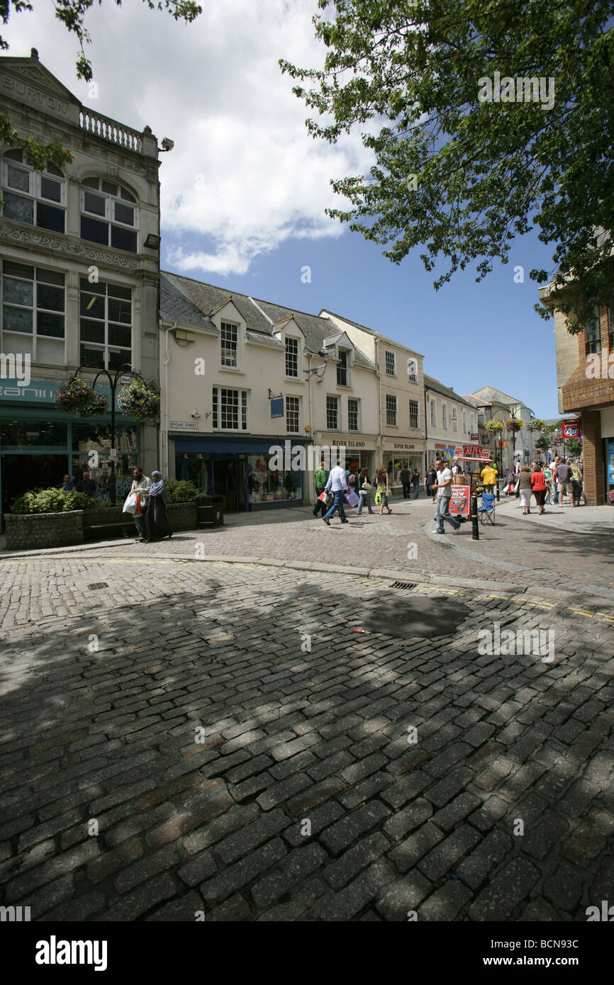 City of Truro, England. Sunny Sunday morning view of a shoppers transiting through Truro’s Pydar Street, viewed from High Cross. Stock Photo