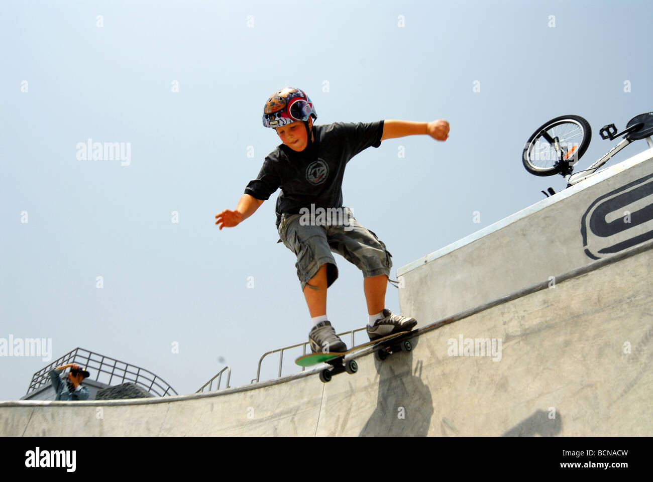 Caucasian boy skateboarding in the park, Shanghai, China Stock Photo