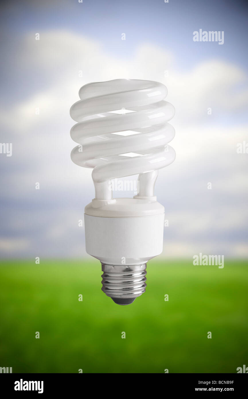 Compact Fluorescent Light Bulb, CFL Bulb Floating In Sky Stock Photo
