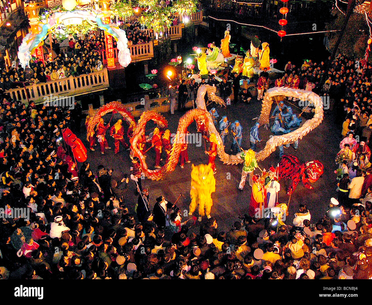 People watch dragon dance performance during Chinese New Year
