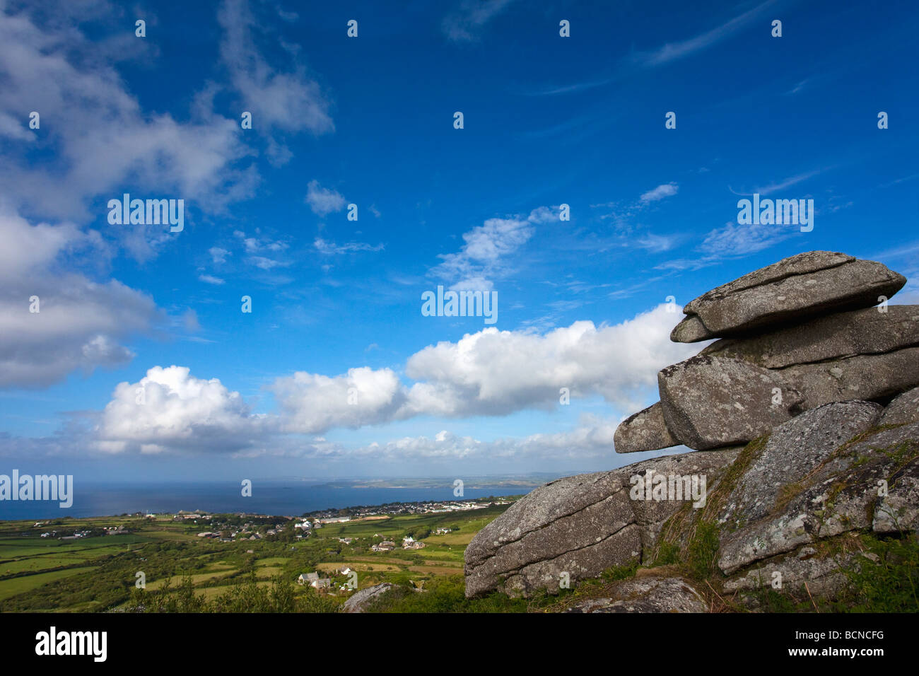 Granite tor of Trendrine Hill in summer sunshine looking toward St Ives West Penwith Cornwall England UK United Kingdom GB Great Stock Photo