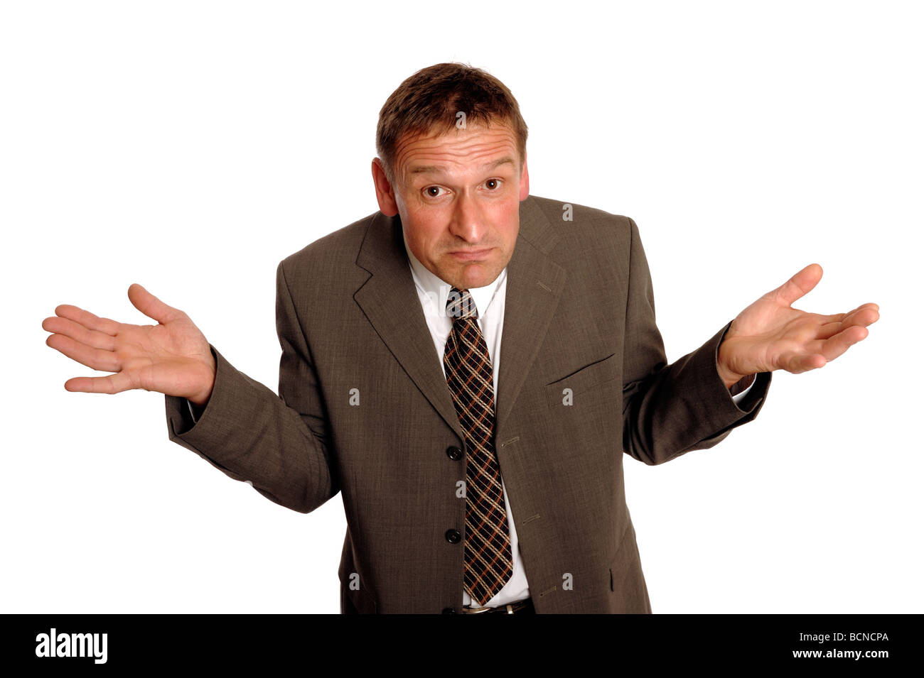 Man in a suit giving a shrug Stock Photo Alamy