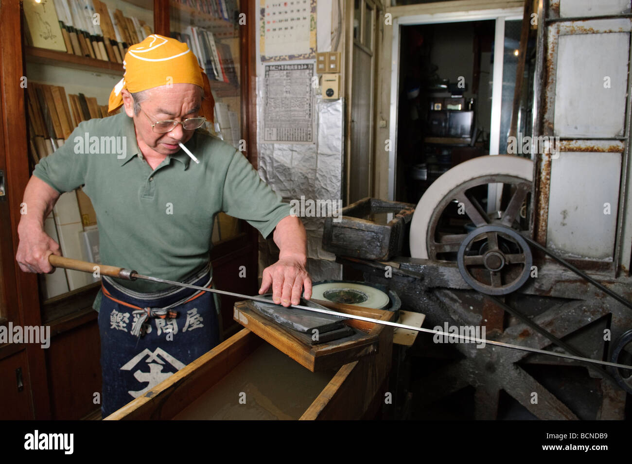 Sharpening a tuna knife, Azuma Knife Shop, Tsukiji fish market, Tokyo