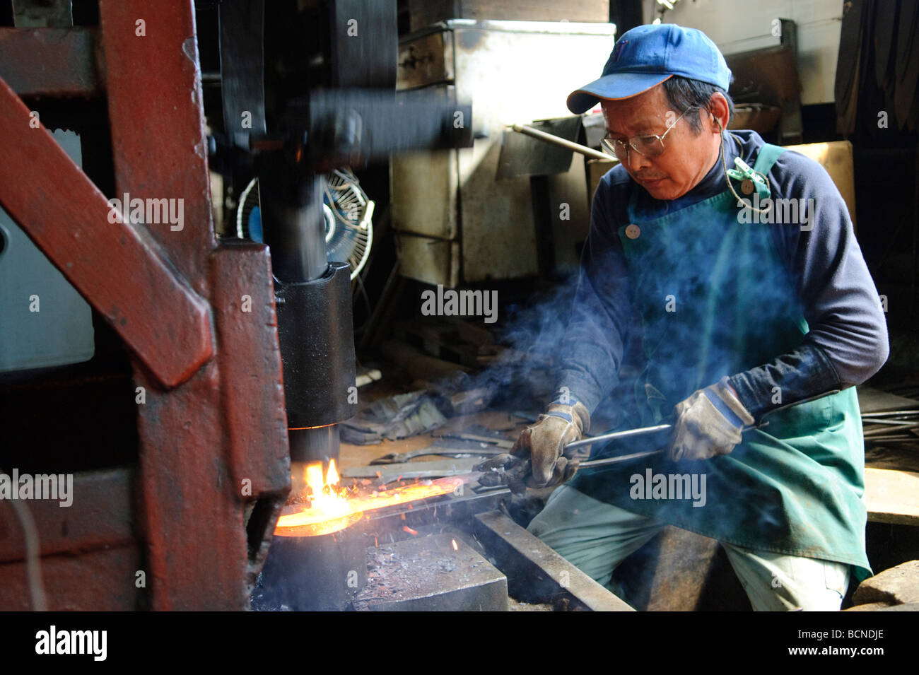 Forging traditional Japanese knives, Takahashi knife factory, Tokyo Japan, August 7 2008. Stock Photo