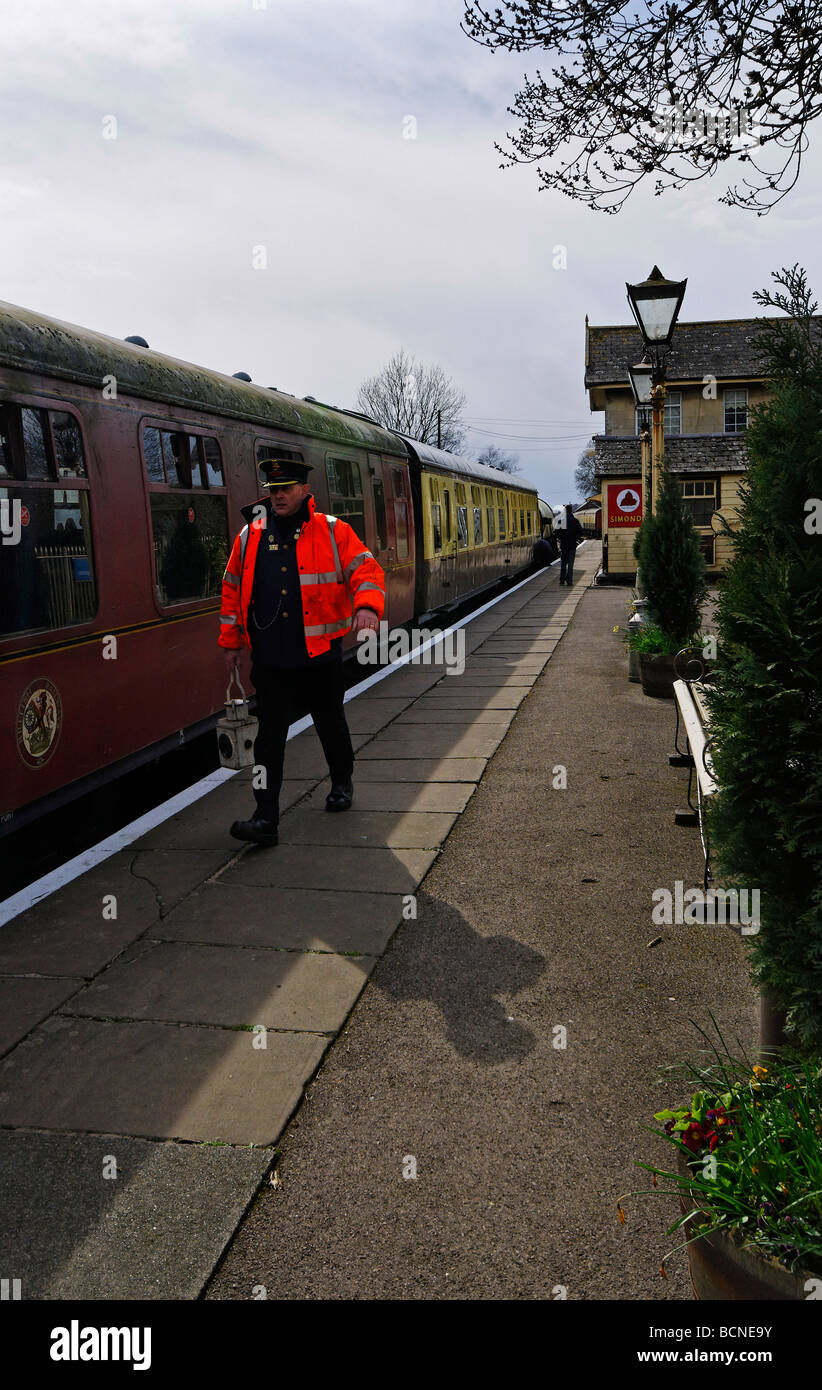 Guard carrying signal lamp, Cranmore Staion, Somerset Stock Photo