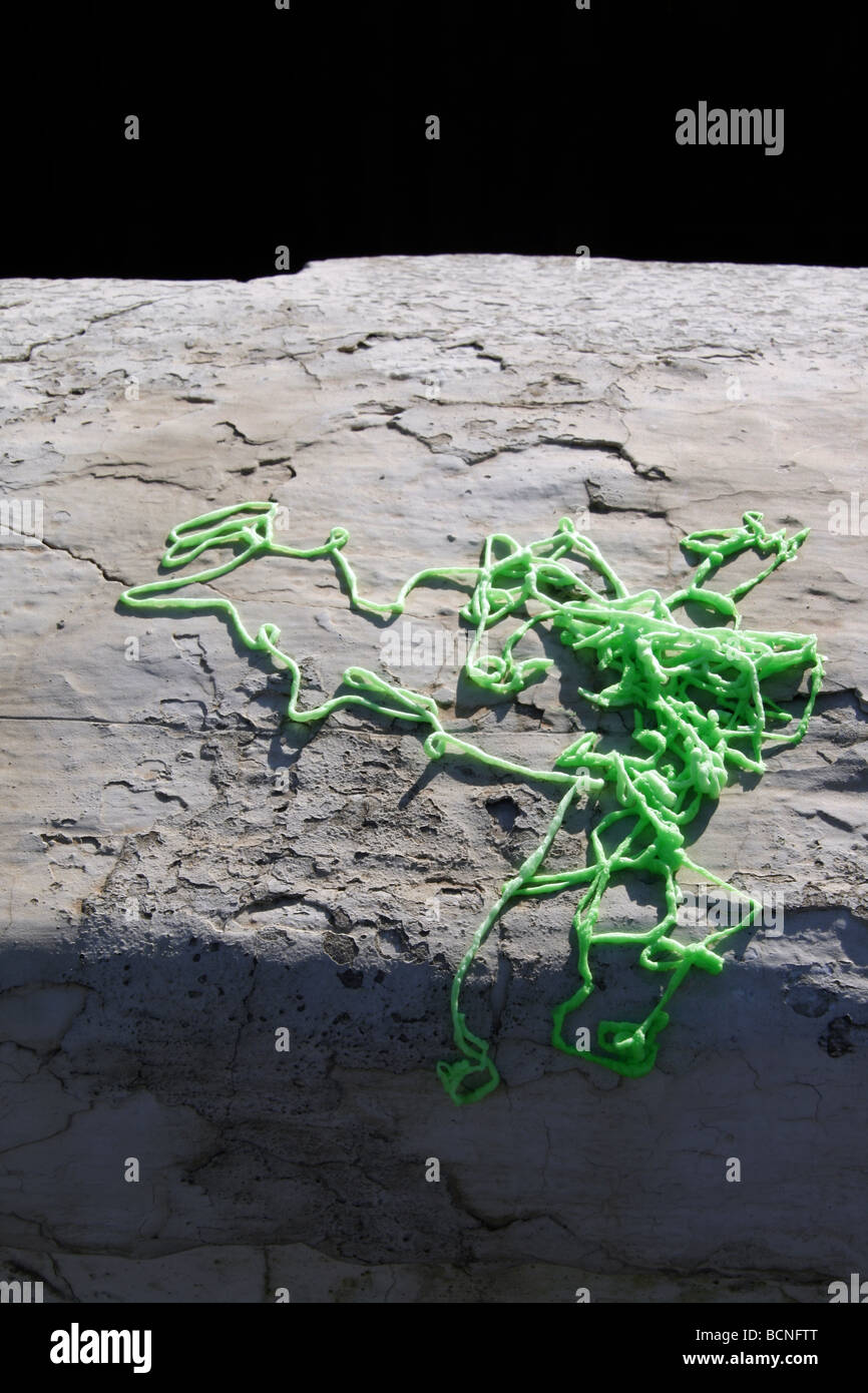 green party streamer spray foam on wall in sun outdoors Stock Photo Alamy