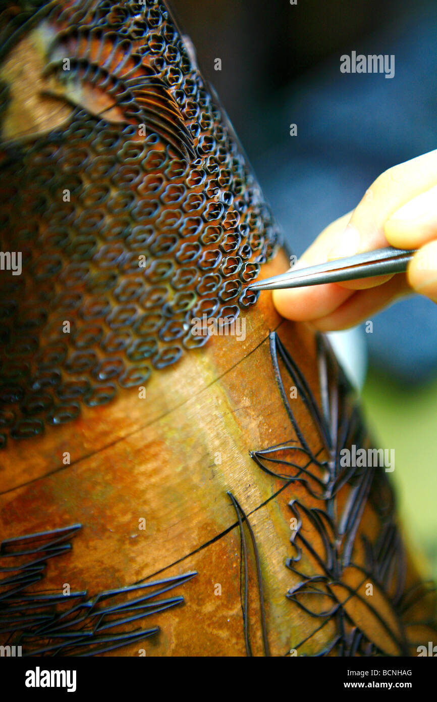 The cloisonné wire is glued to the enamel surface with gum tragacanth, Beijing, China Stock Photo