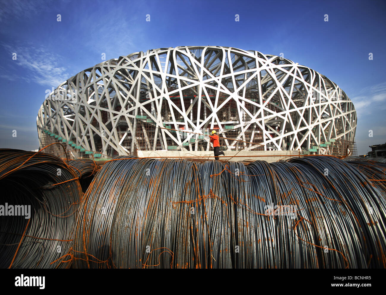 Massive steel coils beside the Bird's Nest under construction, Beijing, China Stock Photo