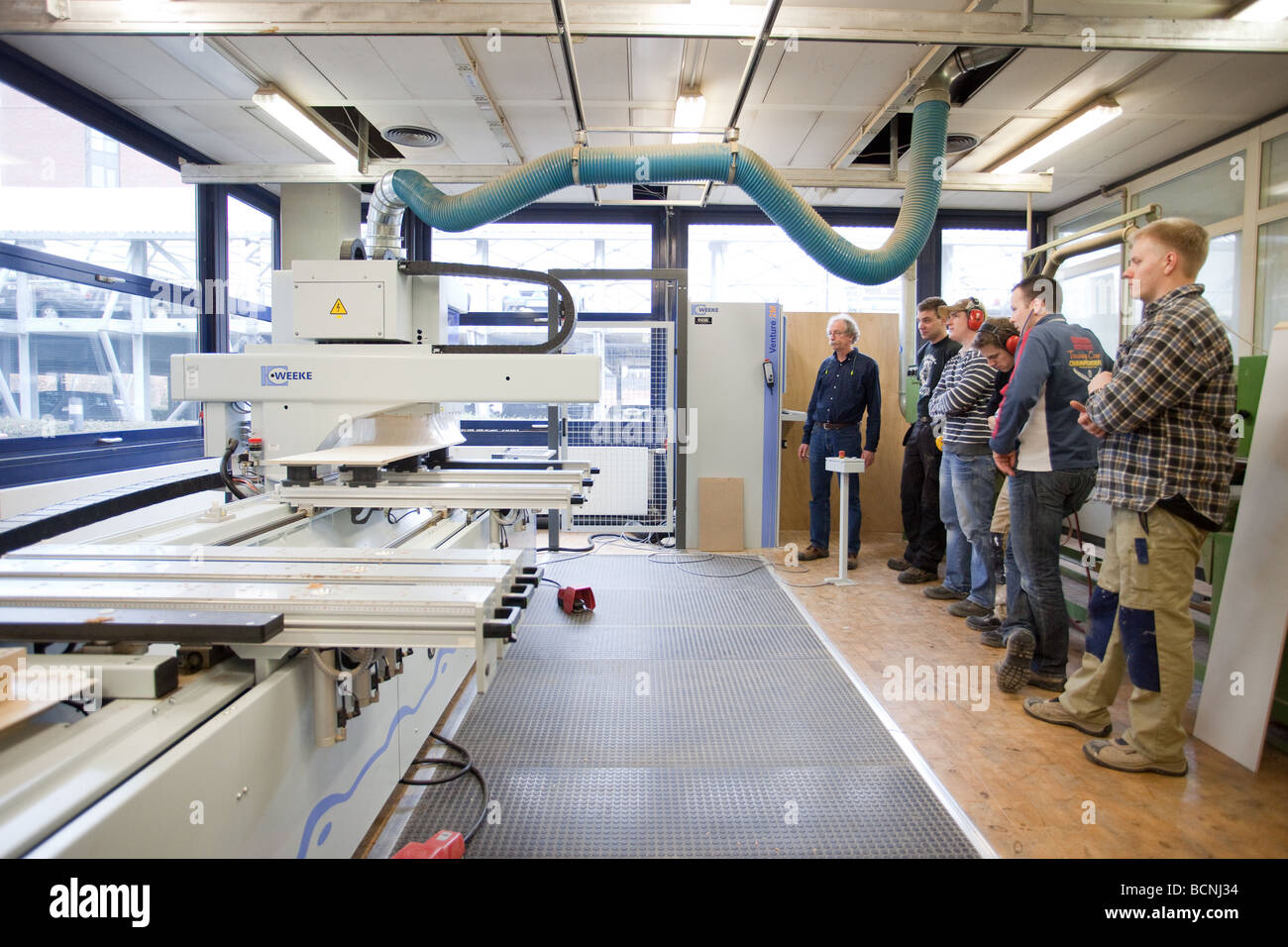 Training for joiners in the school for master craftsmen in the Chamber of Trade CNC milling machine Stock Photo