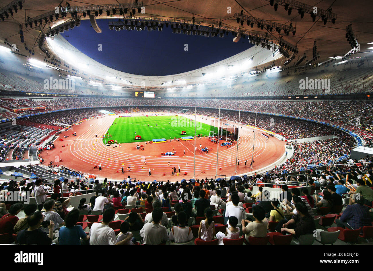 Spectators enjoy games of track and field inside the Bird's Nest Stock Photo: 25061469 - Alamy